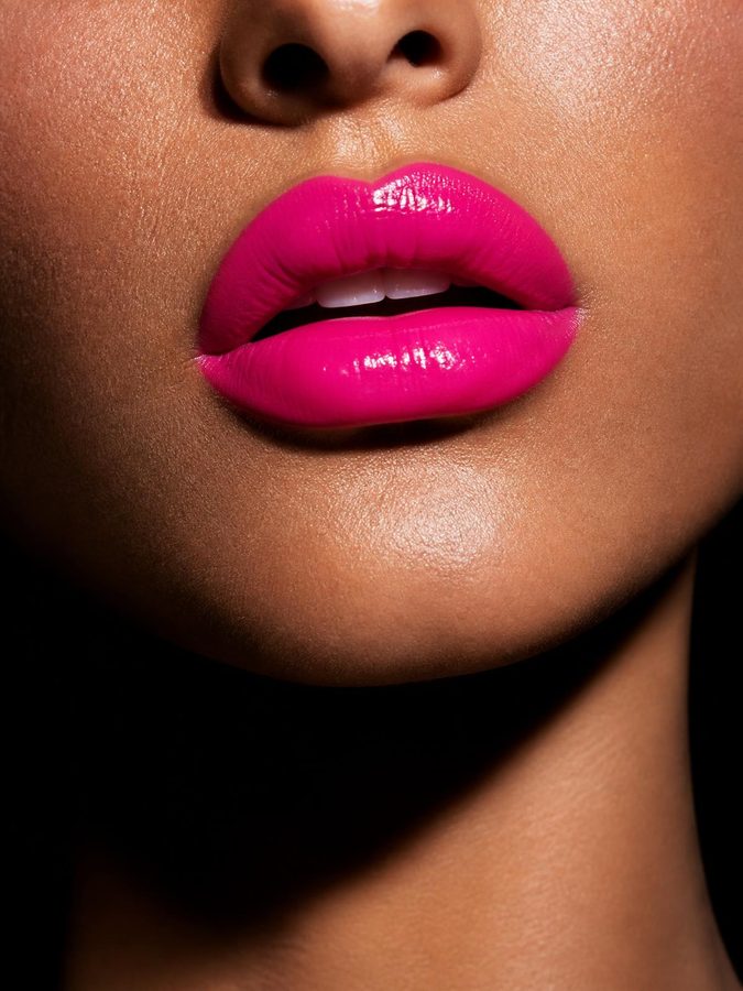 Bold hot pink lips — the Society signature